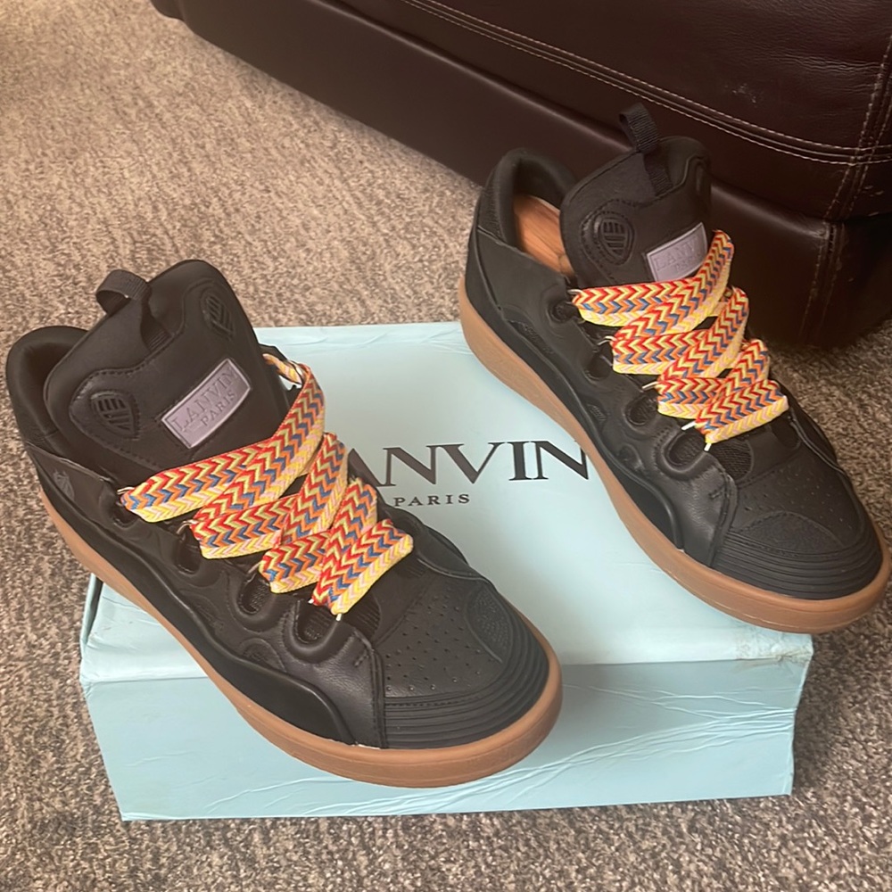 Lanvin Curb sneakers in black with tan sole with the multi color laces as shown.